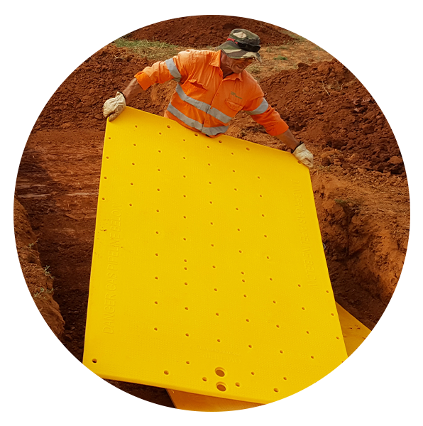 Person holding Overpipe Protection Plates